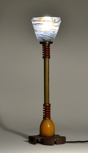 Found objects, hand blown glass, brass and light